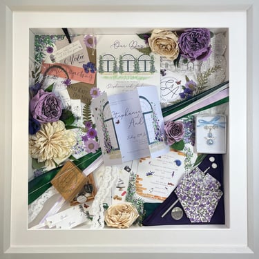 a memory box with keepsakes and a preserved wedding bouquet in a frame
