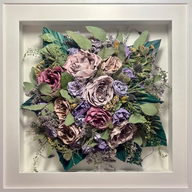 Birdseye view preserved wedding bouquet with teal fern branches in a frame