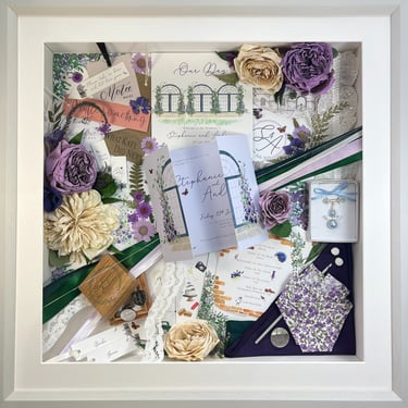 a memory box with keepsakes and a preserved wedding bouquet in a frame