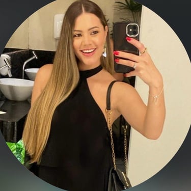 a woman in a black dress is taking a selfie