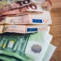 euro banknote collection on wooden surface