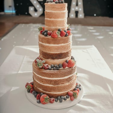 Naked 3 Tier Wedding Cake with Fresh Berries by Sweetcupcakes Cakery