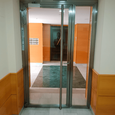 Puerta acero inoxidable Comunidad de propietarios