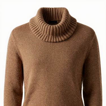 Warm-toned studio shot of a drape-heavy knit sweater showing detailed ribbed collar and soft textile texture.
