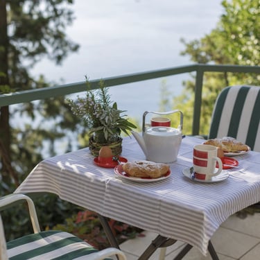 Cozy table and chairs on the apartment terrace with sea and Krk Island views