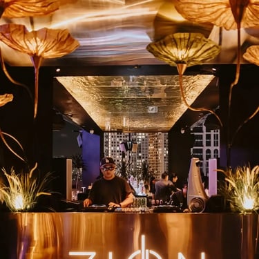 Zion Sky Lounge & Dining Ho Chi Minh Vietnam Saigon DJ Booth area with DJ and warm light decorations