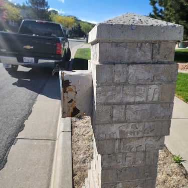 damaged brick mailbox