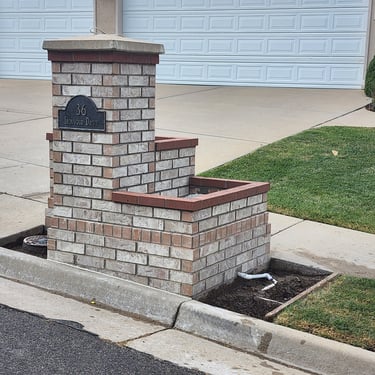 new rebuilt brick mail box with attached planter box