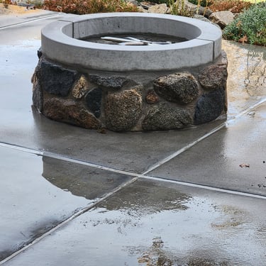 natural stone gas firepit on patio