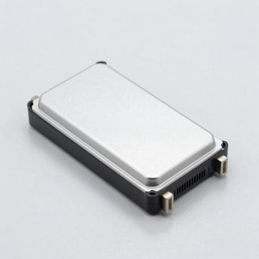 Clean car electronic control unit ECU module, bright studio lighting, neutral light gray background, sharp focus