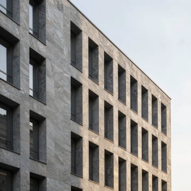 Minimalist geometric facade of a contemporary corporate building in Europe, soft daylight, slate and champagne tones