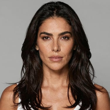 Elegant party decoration with pastel balloons and floral arrangements in a cozy living room.