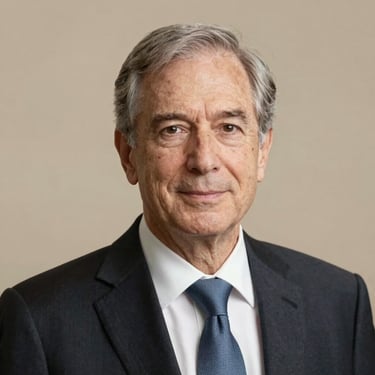 Professional headshot of an elegant senior male academic trustee, warm lighting, clean background.