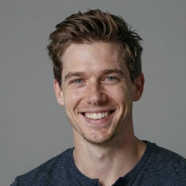 A cheerful man in casual clothes sitting relaxed with a coffee mug.