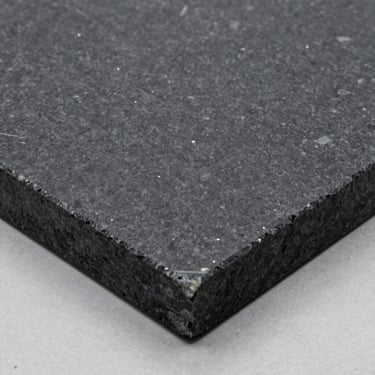 Planed slab of black gabbro stone, showing deep charcoal tones and ultra-precise diamond-cut edges.