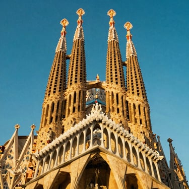 The breathtaking spires of the Sagrada Familia in Barcelona under golden hour sunlight