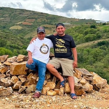 Maestro Mezcaleros in the hills of Oaxaca wearing Machee branded shirts.