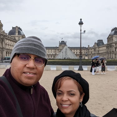 My Wife and I in front of the Louvre Museum in Paris, France