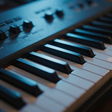 Macro shot of synthesizer keys under cool blue LED studio lighting, shallow depth of field, dust particles in light beam