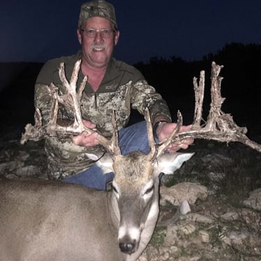 ight photo of a successful trophy whitetail hunt scoring over 170 with Loyal Valley Outfitters.