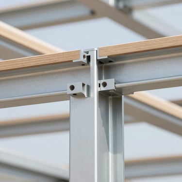 Close-up of seamless aluminum joints in a structural frame, bright natural architectural daylight