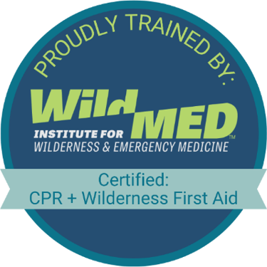 Badge of a WildMed Certified CPR and Wilderness First Aid Practitioner.