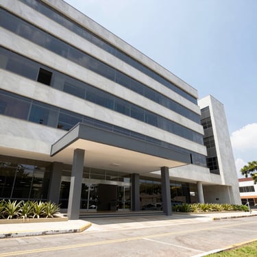 Wide-angle architectural shot of a clean, modern corporate office building entrance in Paraná, bright natural daylight, professional real estate photography.