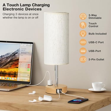 Dimmable touch control lamp with USB ports charging a phone, laptop, and earbuds on a wooden desk.