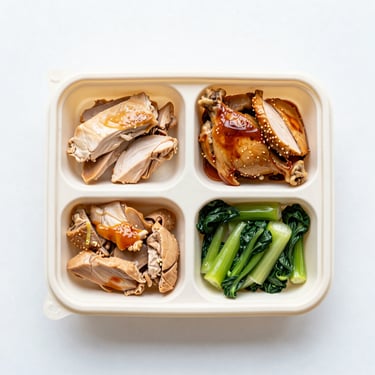 Overhead flat-lay of a premium chicken teriyaki bento box, partitioned compartments, pristine presentation, bright daylight.