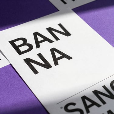 Flat lay of printed modernist brand guidelines, bold black typography on pure white paper, vibrant purple accent pages, sharp daylight shadows