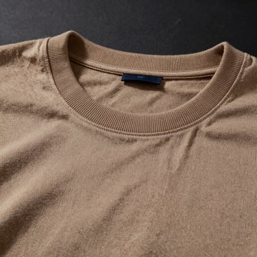 Flat-lay of a structured men's heavy-weight cotton t-shirt neck ribbing, sharp studio lighting