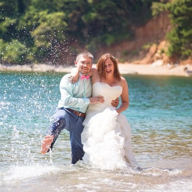 Wedding couple in turquoise sea Budva beach - Bride groom playing laughing Mediterranean water coastal wedding photoshoot