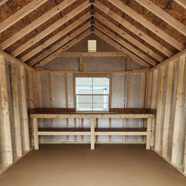 Inside of shed showing workbench and window