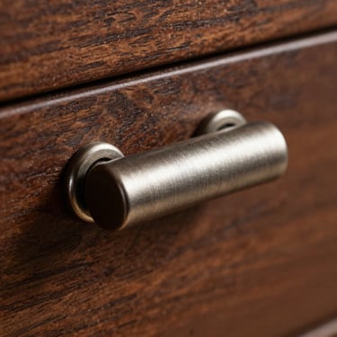 Macro shot of satin steel drawer pulls, detailed metallic texture under sharp side-lighting, shallow depth of field
