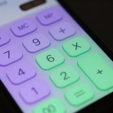 High-angle macro view of a phone screen showing a highly tactile calculator interface with pastel purple and green themed buttons, soft screen-glow.