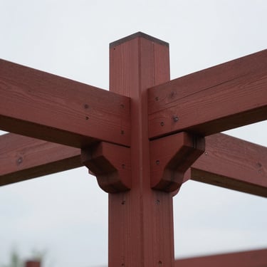 A sharp macro shot of a heritage-grade timber joint, showing millimeter-precision craftsmanship, natural overcast lighting.