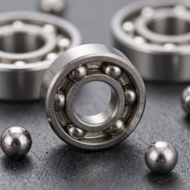 Sharp macro photo of chrome steel ball bearings with metallic reflections, technical lighting