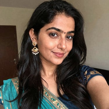 Smiling middle-aged woman with glasses in a bright clinic setting