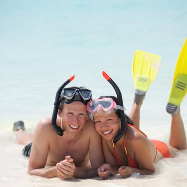 Couple snorkeling and relaxing on the beach in the Dominican Republic