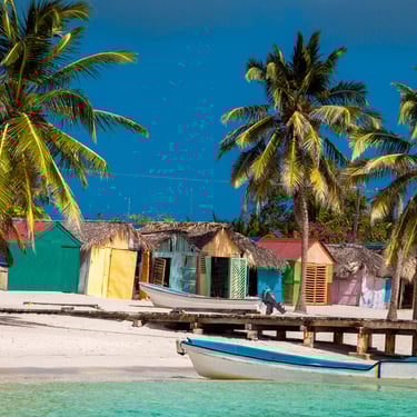 Colorful fishing huts and boats in Mano Juan village on Saona Island, Dominican Republic