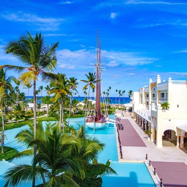 Luxury Punta Cana resort with palm trees, pools, and ocean views in the Dominican Republic