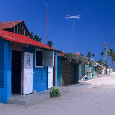 Colorful wooden houses in Mano Juan fishing village on Saona Island, Dominican Republic