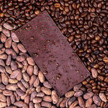 Dark chocolate bar with cacao beans and roasted coffee beans in the Dominican Republic.