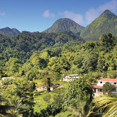 Lush green mountains and rural homes in the Dominican Republic countryside