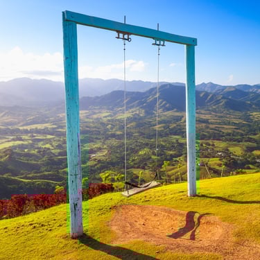 Scenic swing at Montaña Redonda overlooking lush valleys near Los Haitises, Dominican Republic