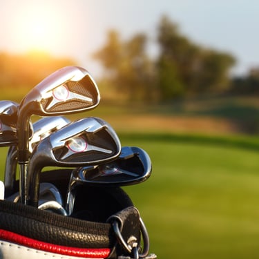 Golf clubs in a bag at a sunny Dominican Republic golf course ready for tee off