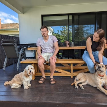 Happy owners at home after training their groodle to be calm