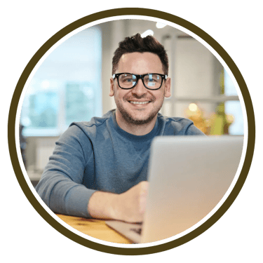 a man with glasses and a laptop computer