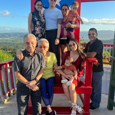 a family in a big decorative puerto rico shair