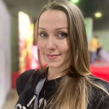 a woman with long hair and a black shirt